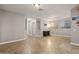 An airy living room boasts tile flooring and recessed lighting at 10772 W Woodland Ave, Avondale, AZ 85323