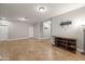 Bright living room with tile floors and recessed lighting fixtures at 10772 W Woodland Ave, Avondale, AZ 85323