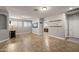 Bright living room with tile floors and recessed lighting fixtures at 10772 W Woodland Ave, Avondale, AZ 85323