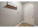 Mud room with coat rack and arched door at 10772 W Woodland Ave, Avondale, AZ 85323