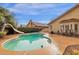 Private backyard with a pool, a slide, and patio area for outdoor entertaining at 12125 N 91St Way, Scottsdale, AZ 85260