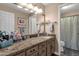 Updated bathroom with a spacious vanity, new fixtures, and granite counters at 12125 N 91St Way, Scottsdale, AZ 85260