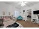 Spacious bedroom with a ceiling fan, comfy chairs, and an ensuite bath at 12125 N 91St Way, Scottsdale, AZ 85260