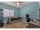 Charming bedroom features blue accent walls, a daybed, and a modern workspace at 12125 N 91St Way, Scottsdale, AZ 85260