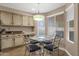 Bright eat-in kitchen features a granite-topped desk and a breakfast nook at 12125 N 91St Way, Scottsdale, AZ 85260