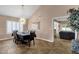 Dining room with tiled floors, contemporary lighting fixture, and easy access to additional living spaces at 12125 N 91St Way, Scottsdale, AZ 85260