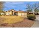 Charming single-story home featuring a well-maintained lawn and a spacious three-car garage at 12125 N 91St Way, Scottsdale, AZ 85260
