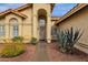 Welcoming front entrance with a decorative archway and desert-style landscaping at 12125 N 91St Way, Scottsdale, AZ 85260