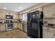 Well-lit kitchen with stainless steel appliances, wooden cabinets, and durable countertops at 12125 N 91St Way, Scottsdale, AZ 85260