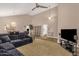Open-concept living space with dining area, tiled floors, carpet, and lots of natural light from windows and sliding doors at 12125 N 91St Way, Scottsdale, AZ 85260