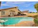 Private pool with patio furniture and lush landscaping surrounded by home exterior at 12125 N 91St Way, Scottsdale, AZ 85260