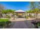 Landscaped backyard showcasing a gazebo seating area and well-maintained greenery at 12508 W Highland Ave, Litchfield Park, AZ 85340