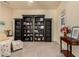 Cozy living room features stylish bookcases and comfortable seating arrangements at 12508 W Highland Ave, Litchfield Park, AZ 85340