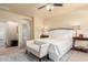 Cozy main bedroom featuring carpet floors, ensuite bathroom access, and ample closet space at 12508 W Highland Ave, Litchfield Park, AZ 85340