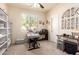 Comfortable office space with natural light, built-in shelving, and functional furnishings at 12508 W Highland Ave, Litchfield Park, AZ 85340