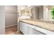 Bright bathroom boasts granite counters, double mirrors, and a shower at 12720 W Mandalay Ln, El Mirage, AZ 85335