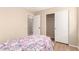 Bedroom showcasing closet, bathroom entrances, and comfortable interior design at 12720 W Mandalay Ln, El Mirage, AZ 85335