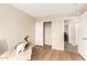 Home office with closet, neutral walls, and light wood flooring at 12720 W Mandalay Ln, El Mirage, AZ 85335