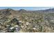 Panoramic aerial of sprawling suburban neighborhood set in the desert foothills against a backdrop of mountains at 1340 E Las Palmaritas Dr, Phoenix, AZ 85020