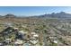 Expansive aerial view shows vast suburban neighborhood and mountain range against clear skies at 1340 E Las Palmaritas Dr, Phoenix, AZ 85020