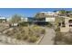 Aerial view of modern home on a hillside with desert landscaping at 1340 E Las Palmaritas Dr, Phoenix, AZ 85020