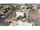 Aerial view of neighborhood featuring triangular modern house, with landscape, fire pit and spa, nestled in desert setting at 1340 E Las Palmaritas Dr, Phoenix, AZ 85020