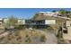 Aerial view of a modern home on a hillside with desert landscaping and a driveway at 1340 E Las Palmaritas Dr, Phoenix, AZ 85020