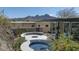A backyard featuring a round swimming pool with mountain views in the background at 1340 E Las Palmaritas Dr, Phoenix, AZ 85020