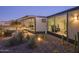 Modern backyard with spa, gravel, cacti, and large windows into a bright home gym at 1340 E Las Palmaritas Dr, Phoenix, AZ 85020
