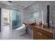 Modern bathroom with unique sink bowl, mosaic tile walls, and decorative accessories at 1340 E Las Palmaritas Dr, Phoenix, AZ 85020