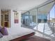 Bright bedroom features a sliding glass door to a deck with views of the hills and city at 1340 E Las Palmaritas Dr, Phoenix, AZ 85020