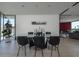 Open dining room features a glass table with seating for eight and access to the living area at 1340 E Las Palmaritas Dr, Phoenix, AZ 85020
