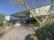 Modern home with an elevated design, xeriscaping, and driveway leading to covered parking at 1340 E Las Palmaritas Dr, Phoenix, AZ 85020