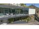 Modern home exterior with balconies, large windows and desert landscaping at 1340 E Las Palmaritas Dr, Phoenix, AZ 85020