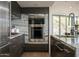 Contemporary kitchen featuring stainless steel appliances and a granite countertop at 1340 E Las Palmaritas Dr, Phoenix, AZ 85020