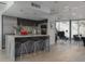 Open-concept kitchen with island seating, granite countertops, and stainless steel appliances at 1340 E Las Palmaritas Dr, Phoenix, AZ 85020