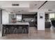 Modern kitchen features island seating, stainless steel appliances, and open layout at 1340 E Las Palmaritas Dr, Phoenix, AZ 85020