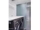 Modern laundry room featuring a front-load washer and dryer and a sleek, contemporary design at 1340 E Las Palmaritas Dr, Phoenix, AZ 85020