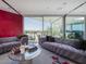 Bright living room boasts large windows and comfortable seating with a view of the city at 1340 E Las Palmaritas Dr, Phoenix, AZ 85020