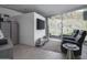 Relaxing living room with large picture window, contemporary furniture, and minimalist decor at 1340 E Las Palmaritas Dr, Phoenix, AZ 85020