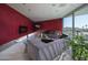 Spacious living room with modern decor, vibrant accent wall, and expansive windows at 1340 E Las Palmaritas Dr, Phoenix, AZ 85020