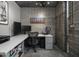 Modern office space with exposed brick wall, contemporary desk, and industrial-style design at 1340 E Las Palmaritas Dr, Phoenix, AZ 85020