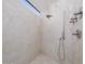 Modern shower with tile walls, overhead and handheld shower heads, and a contemporary design at 1340 E Las Palmaritas Dr, Phoenix, AZ 85020