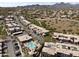 An aerial view of a property highlighting a pool, well maintained landscaping and mountain views at 13700 N Fountain Hills Blvd # 365, Fountain Hills, AZ 85268