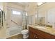 Bathroom featuring tub and shower combination, granite vanity top, and decorative floral shower curtain at 13700 N Fountain Hills Blvd # 365, Fountain Hills, AZ 85268