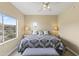 Comfortable bedroom with natural light, neutral colors, and a decorative patterned comforter at 13700 N Fountain Hills Blvd # 365, Fountain Hills, AZ 85268