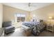 Bright, modern bedroom featuring a ceiling fan and a desert landscape view at 13700 N Fountain Hills Blvd # 365, Fountain Hills, AZ 85268