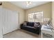 Cozy bedroom features a ceiling fan, a work area, and a comfortable sofa with decorative pillows at 13700 N Fountain Hills Blvd # 365, Fountain Hills, AZ 85268