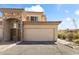 Charming home featuring a stone facade, two-car garage, and desert landscaping at 13700 N Fountain Hills Blvd # 365, Fountain Hills, AZ 85268