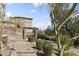 Exterior view of a two-story home, showing garden path with pergola and desert landscaping at 13700 N Fountain Hills Blvd # 365, Fountain Hills, AZ 85268